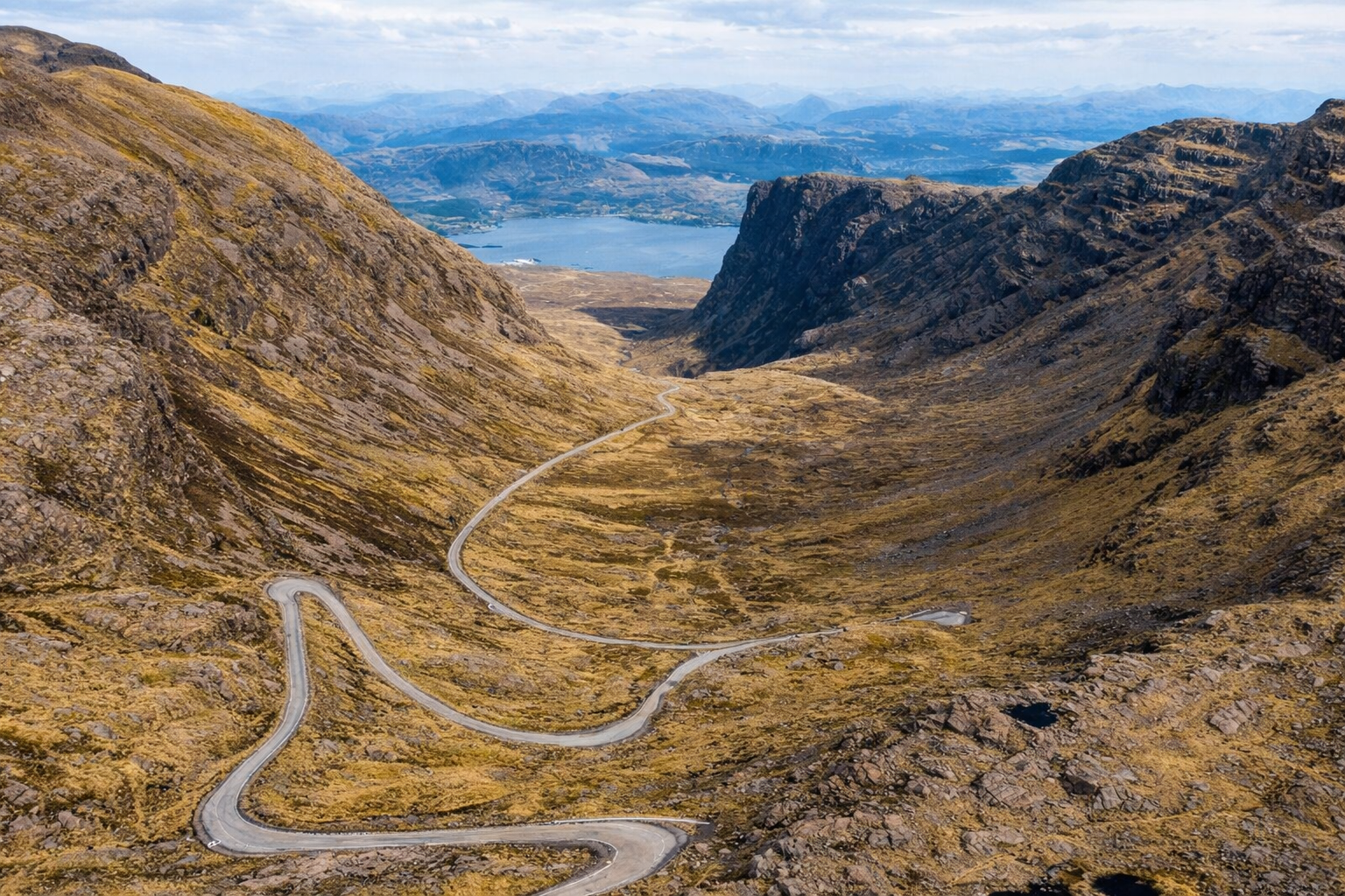 Bealach na Bà mountain pass - Challenging hairpin turns on the best road trips in Scotland